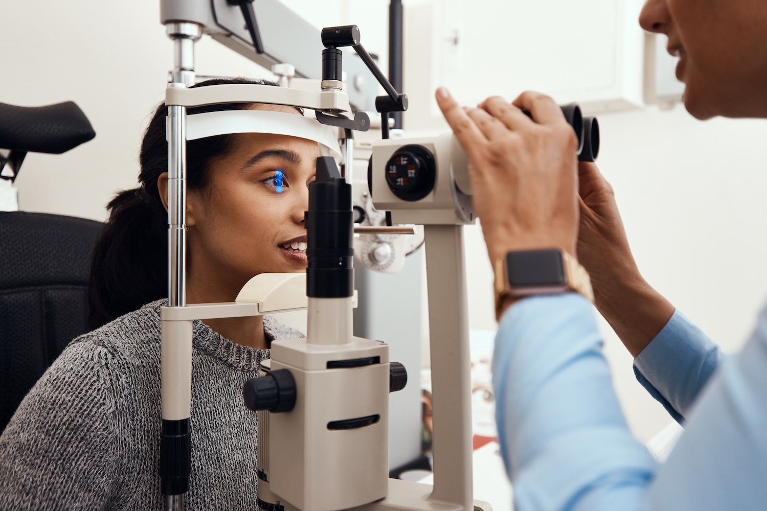 Eye test, exam or screening with an ophthalmoscope and an optometrist or optician in the optometry industry. Young woman getting her eyes tested for prescription glasses or contact lenses for vision Comprehensive eye care services at Precision Eye Clinic in Savannah, TN